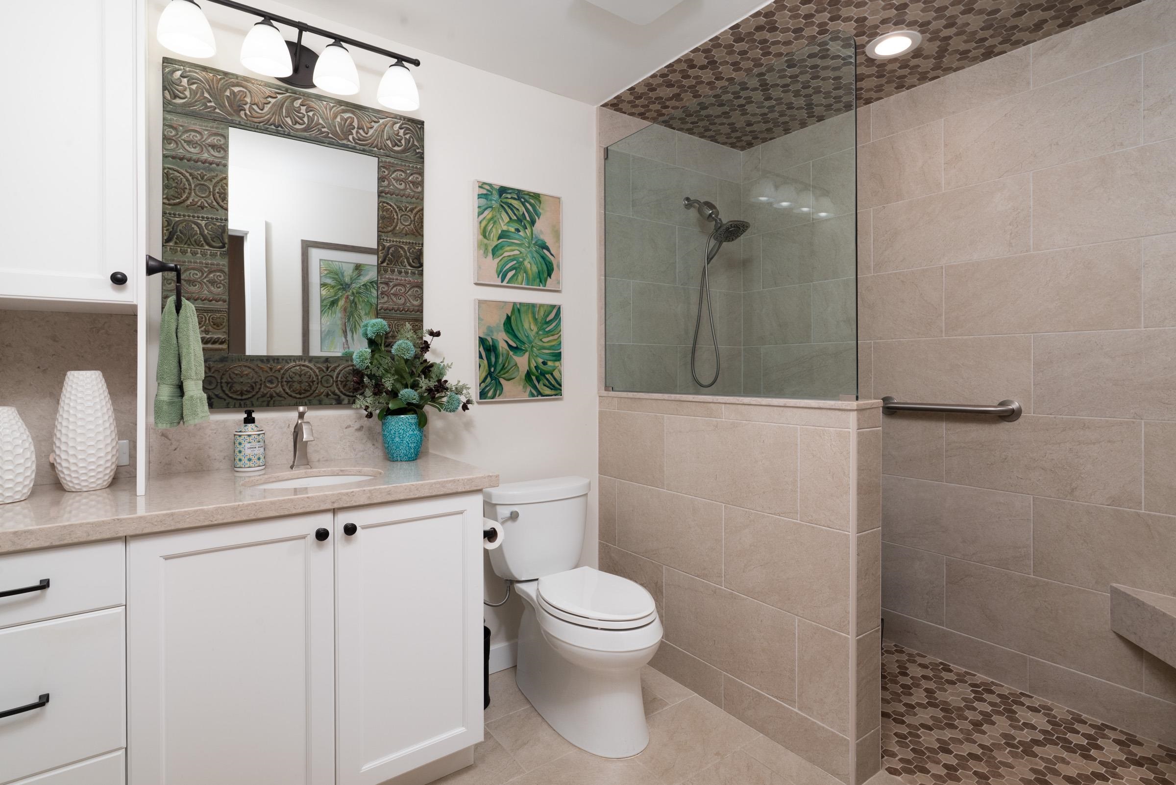 50 Puu Anoano Street, Unit 2804 Lahaina, HI 96761 - Photo 34 of 49 a bathroom with a toilet a sink and shower