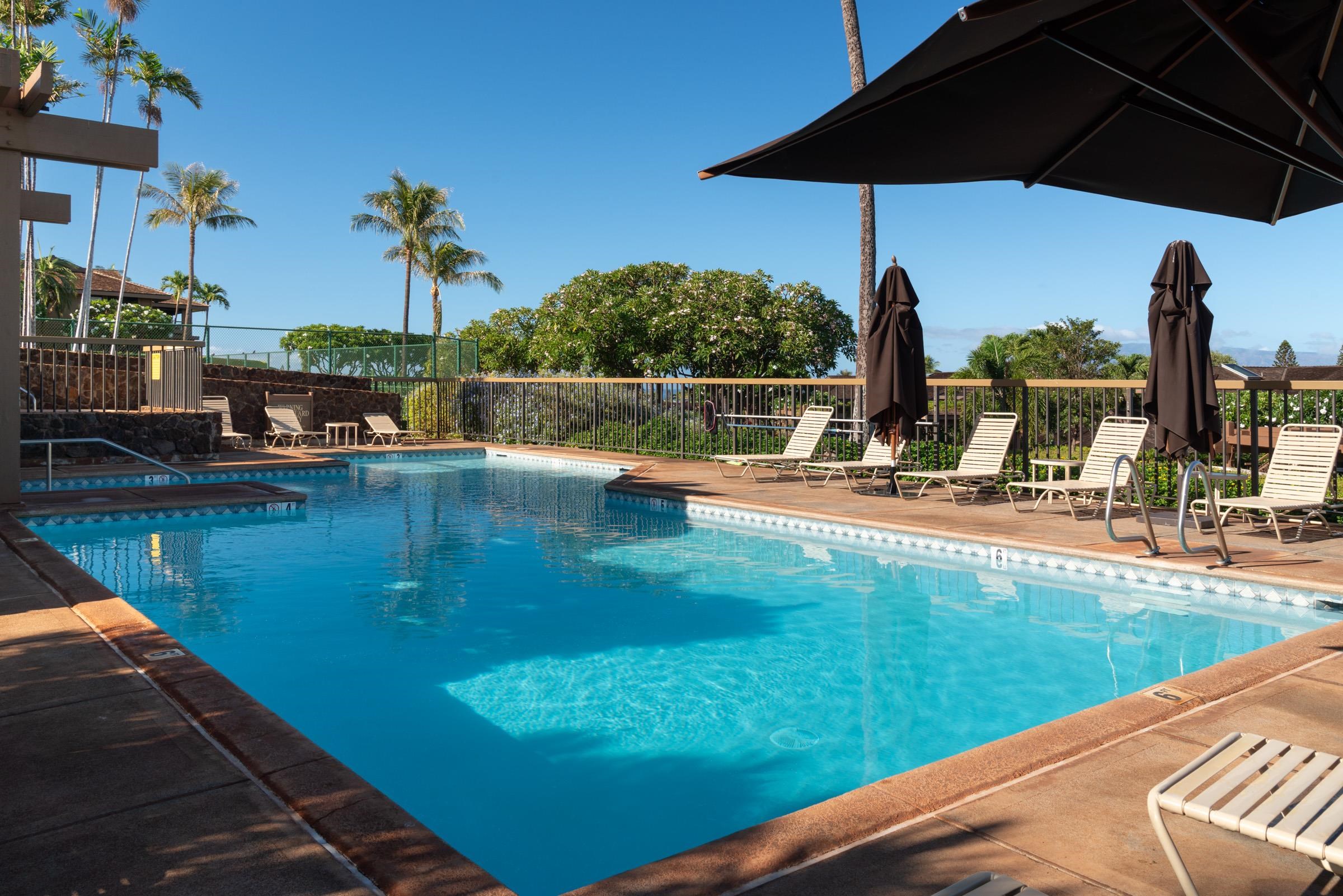 50 Puu Anoano Street, Unit 2804 Lahaina, HI 96761 - Photo 42 of 49 a view of a swimming pool with a patio