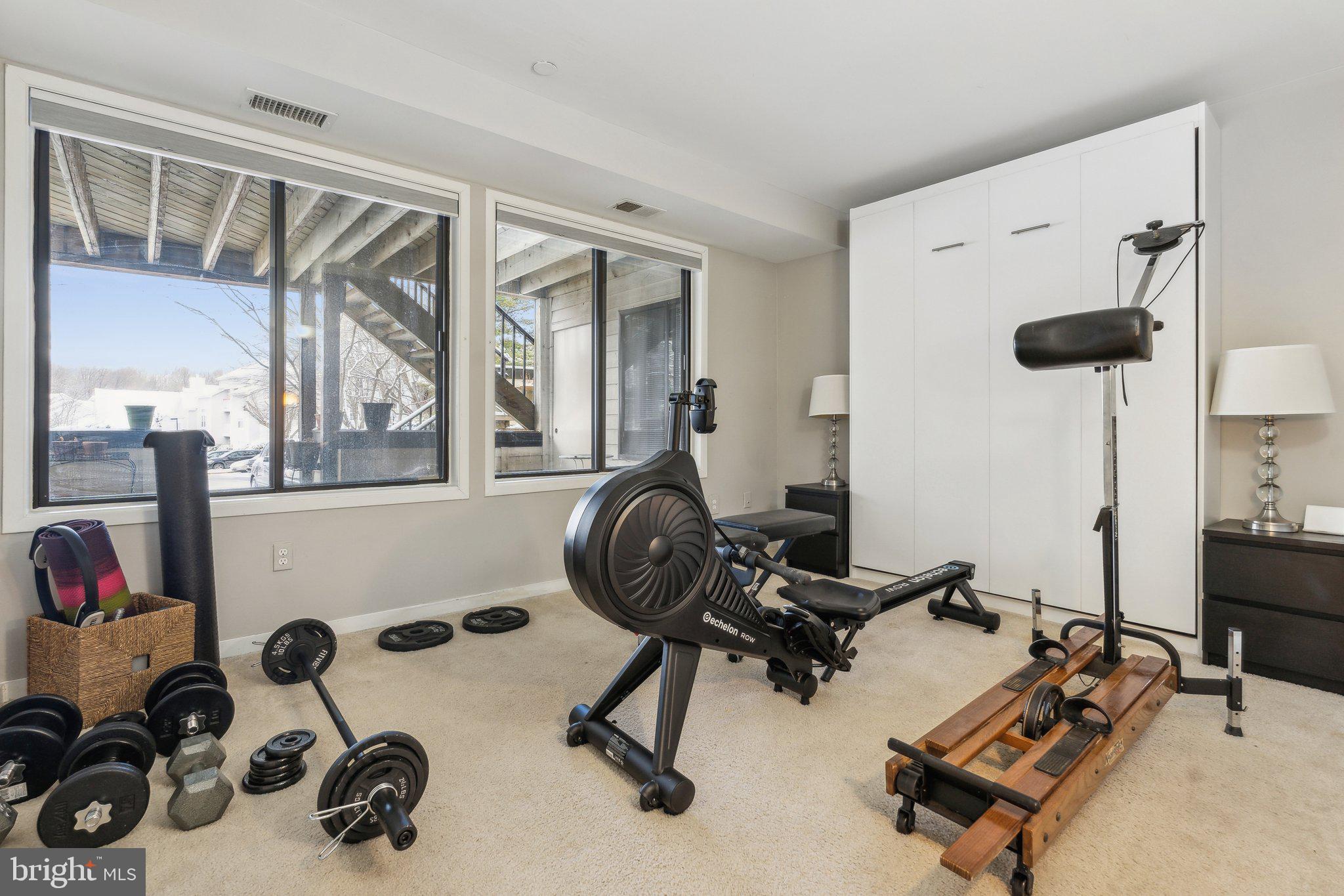 10108 Hellingly Place, Unit 300 Gaithersburg, MD 20886 - Photo 15 of 22 a room with gym equipment and a large window