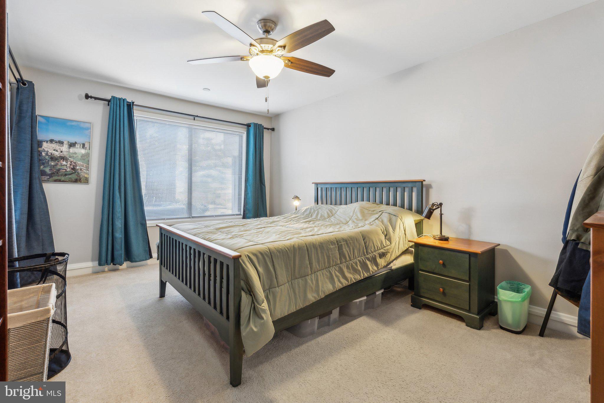 10108 Hellingly Place, Unit 300 Gaithersburg, MD 20886 - Photo 7 of 22 a bed sitting in a room next to a window