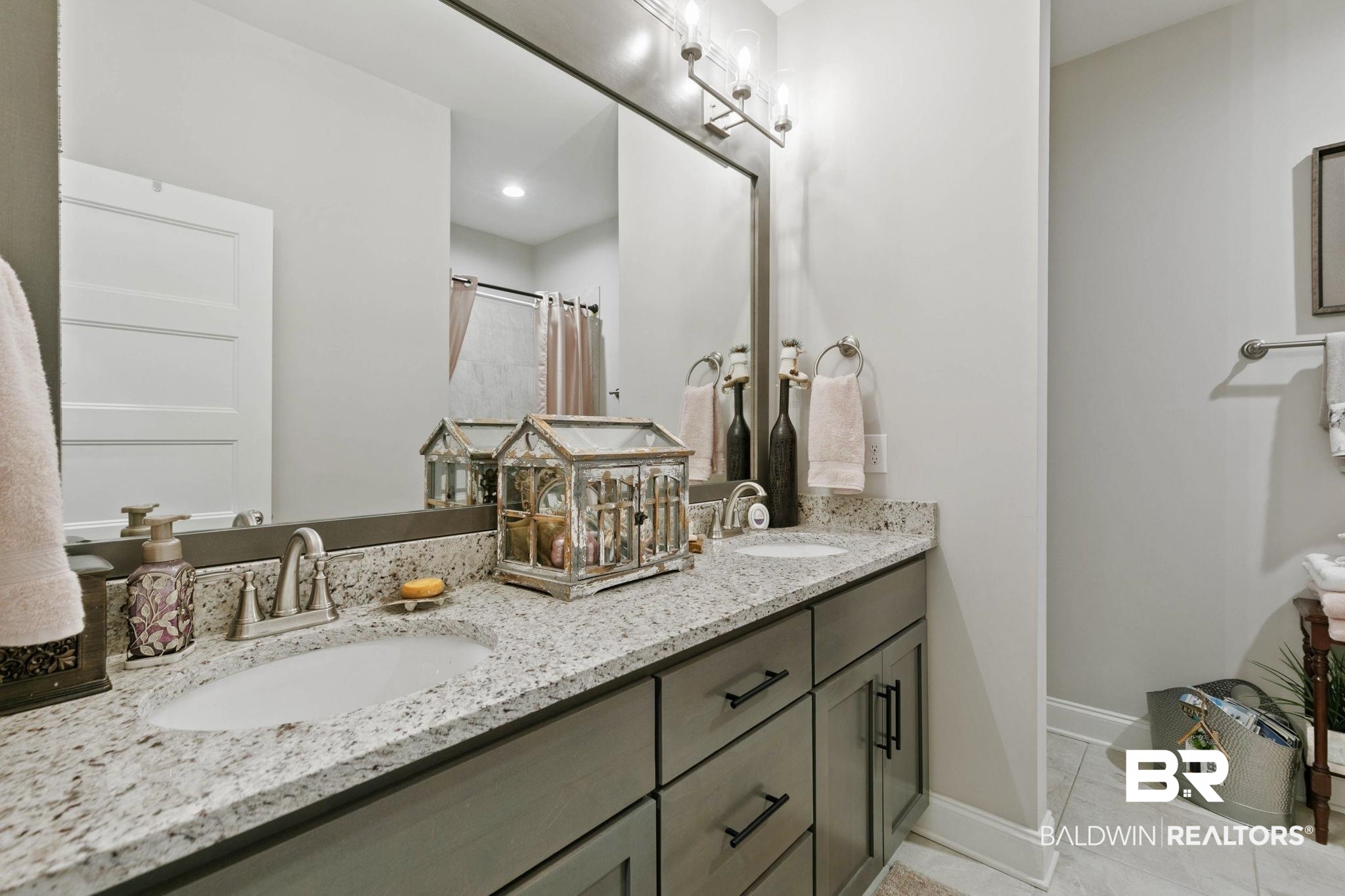 291 Hemlock Drive Fairhope, AL 36532 - Photo 43 of 65 Full bathroom with double vanity and a shower with shower curtain