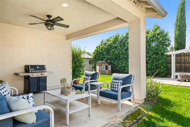 a view of a patio with a table and chairs