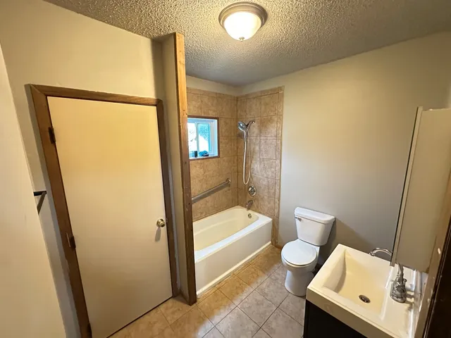 a bathroom with a bathtub and toilet