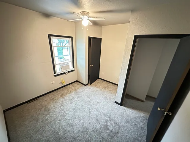 a view of empty room with windows