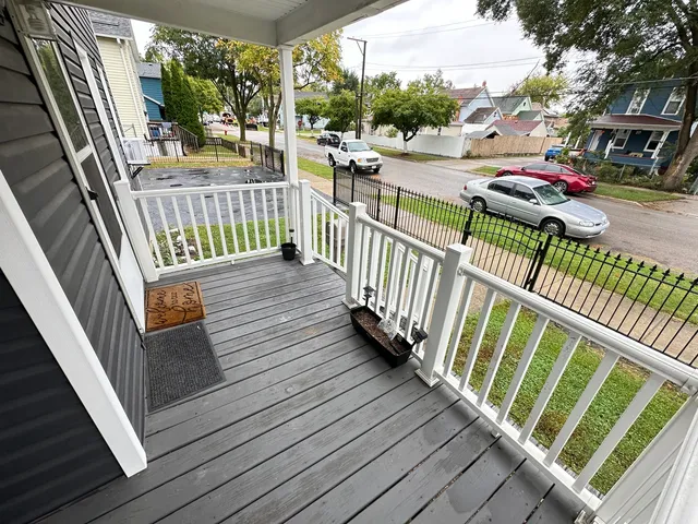 a view of balcony with wooden floor