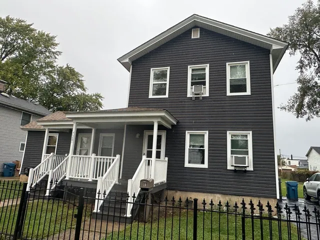 a front view of a house with a balcony