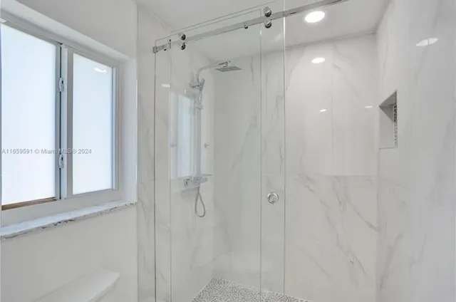 a swimming pool with outdoor seating and yard