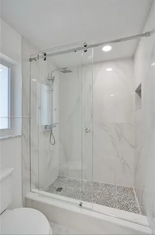 a backyard of a house with yard and outdoor seating