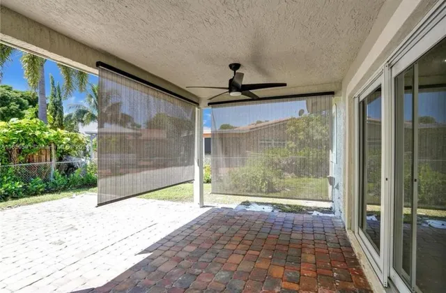 a view of a house with basketball court
