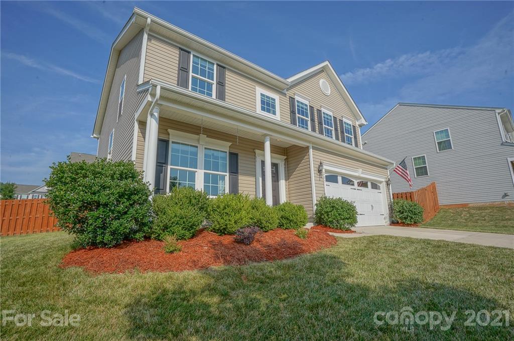 285 Almora Loop Mooresville, NC 28115 - Photo 2 of 45 a front view of a house with a yard