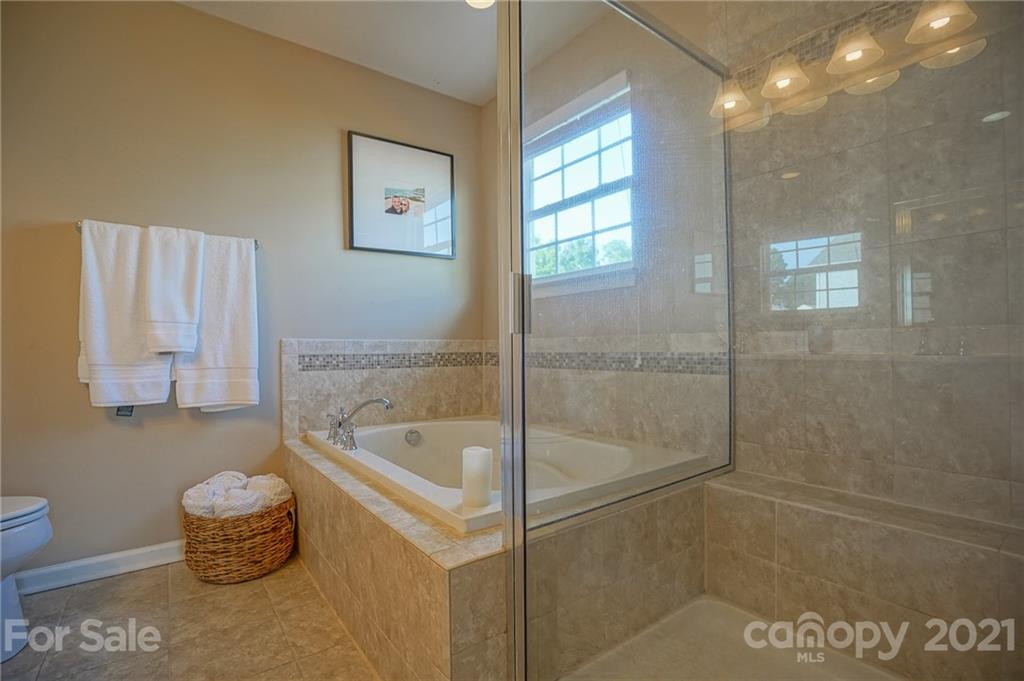 285 Almora Loop Mooresville, NC 28115 - Photo 21 of 45 a bathroom with a bathtub and a shower