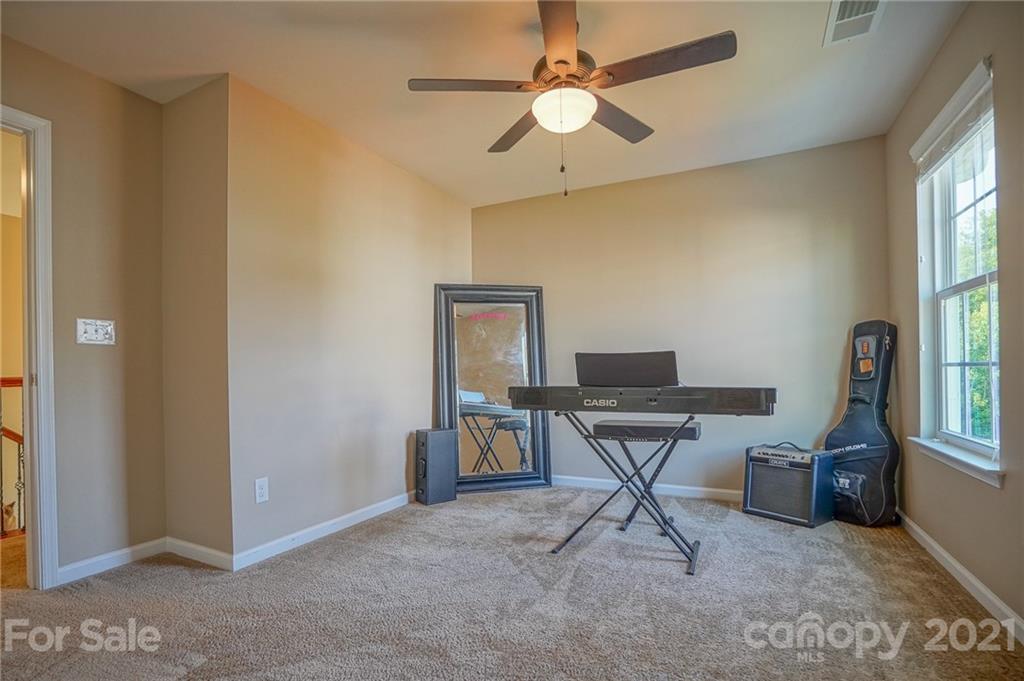 285 Almora Loop Mooresville, NC 28115 - Photo 23 of 45 a view of a workspace with furniture and a window