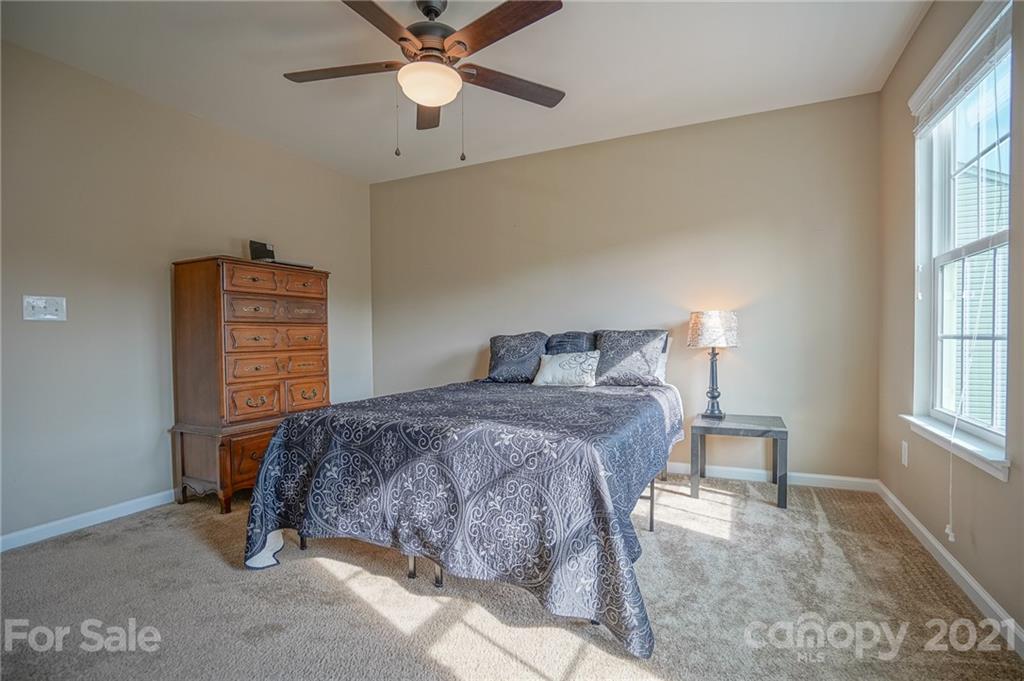 285 Almora Loop Mooresville, NC 28115 - Photo 26 of 45 a bedroom with a bed and a window
