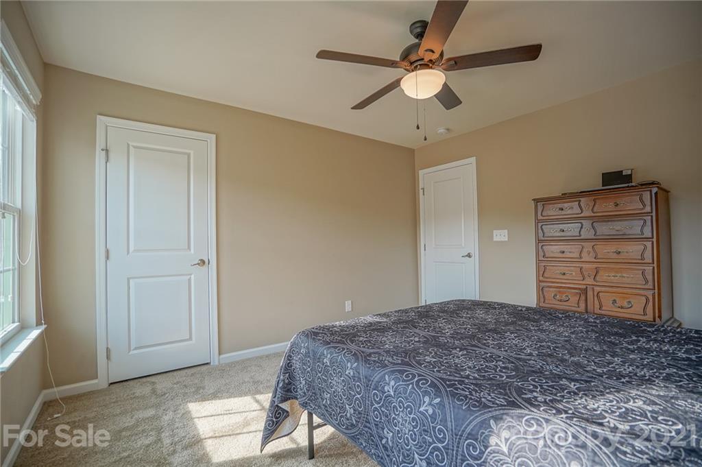 285 Almora Loop Mooresville, NC 28115 - Photo 27 of 45 a bedroom with a bed and a dresser