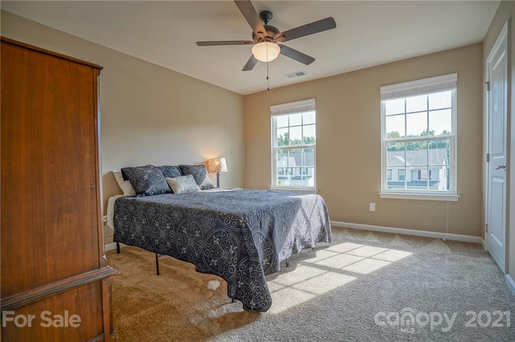 285 Almora Loop Mooresville, NC 28115 - Photo 28 of 45 a bedroom with a bed and window