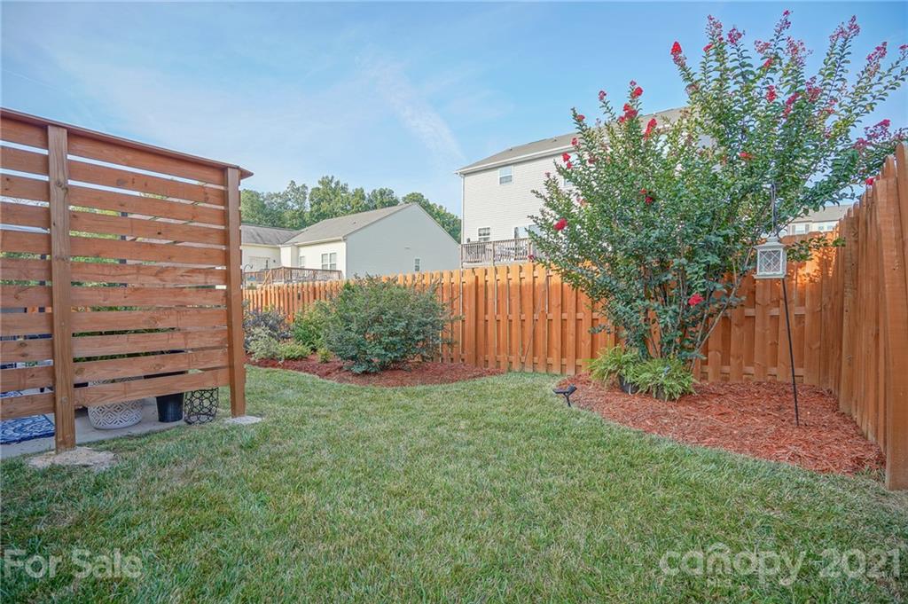 285 Almora Loop Mooresville, NC 28115 - Photo 29 of 45 a view of a backyard with a garden