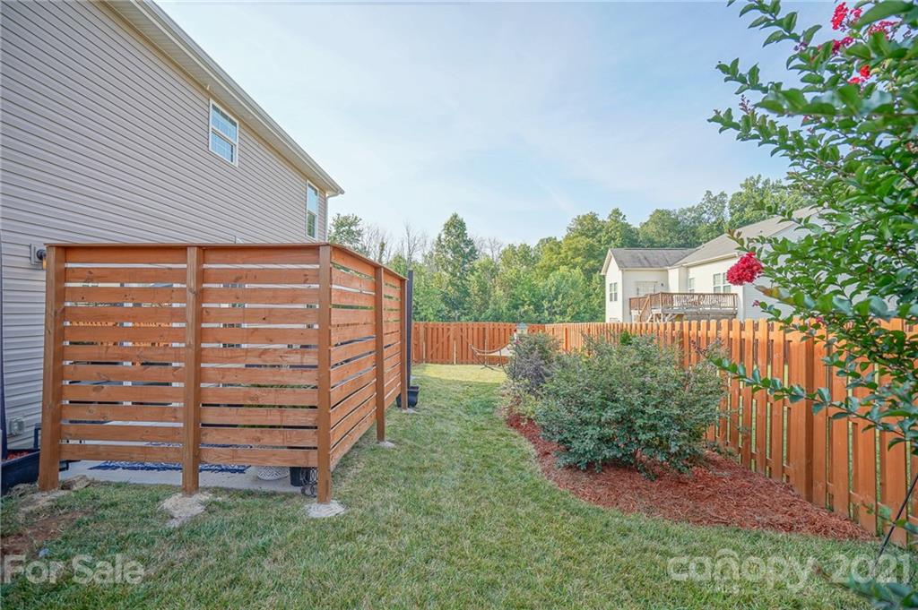 285 Almora Loop Mooresville, NC 28115 - Photo 30 of 45 a backyard of a house with lots of green space