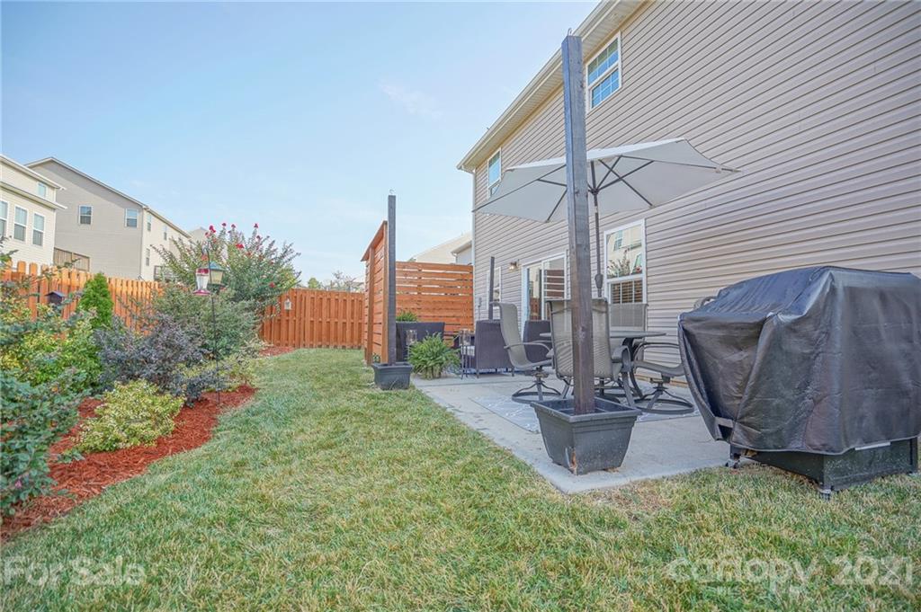 285 Almora Loop Mooresville, NC 28115 - Photo 31 of 45 a view of a chair and table in the backyard