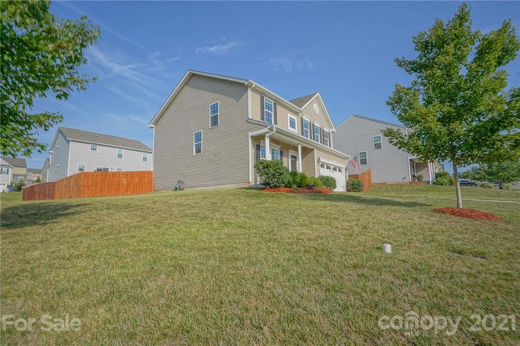 285 Almora Loop Mooresville, NC 28115 - Photo 36 of 45 a backyard of a house with lots of green space