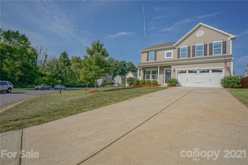 285 Almora Loop Mooresville, NC 28115 - Photo 40 of 45 a front view of a house with a yard