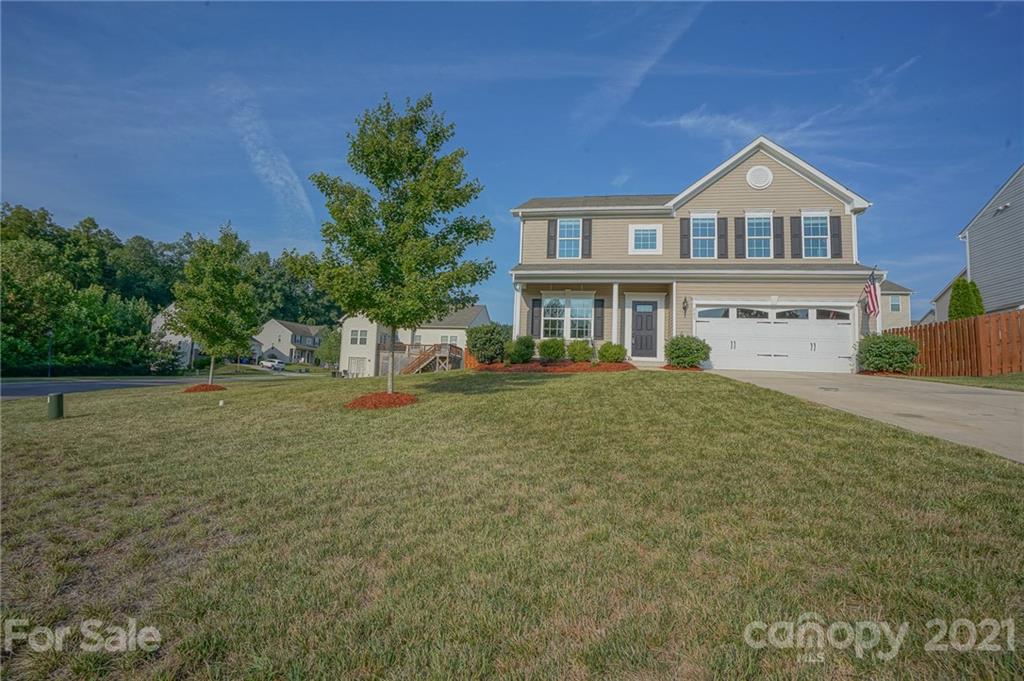 285 Almora Loop Mooresville, NC 28115 - Photo 42 of 45 a front view of a house with a yard