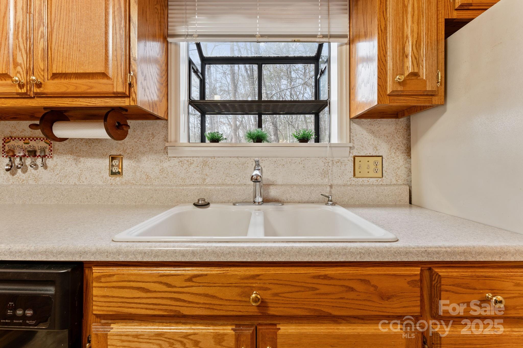 184 Trimont Mountain Road Franklin, NC 28734 - Photo 11 of 41 a kitchen with a sink and a window