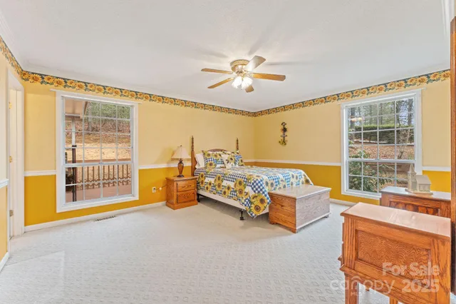 a bedroom with furniture and a window