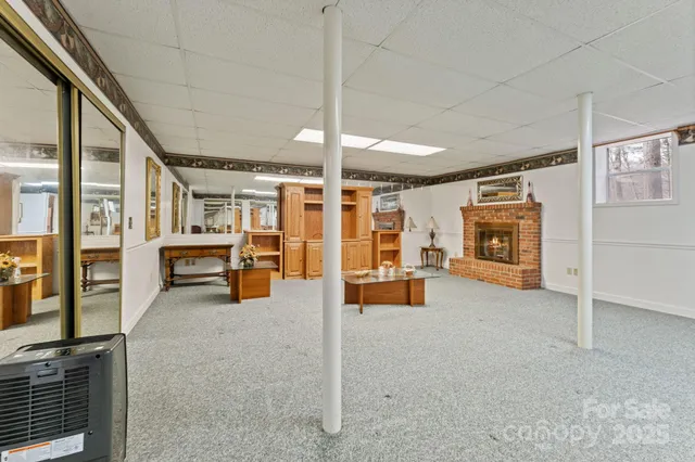 a view of living room with furniture and fireplace