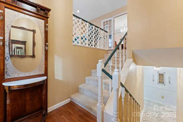 a view of entryway and hall with wooden floor