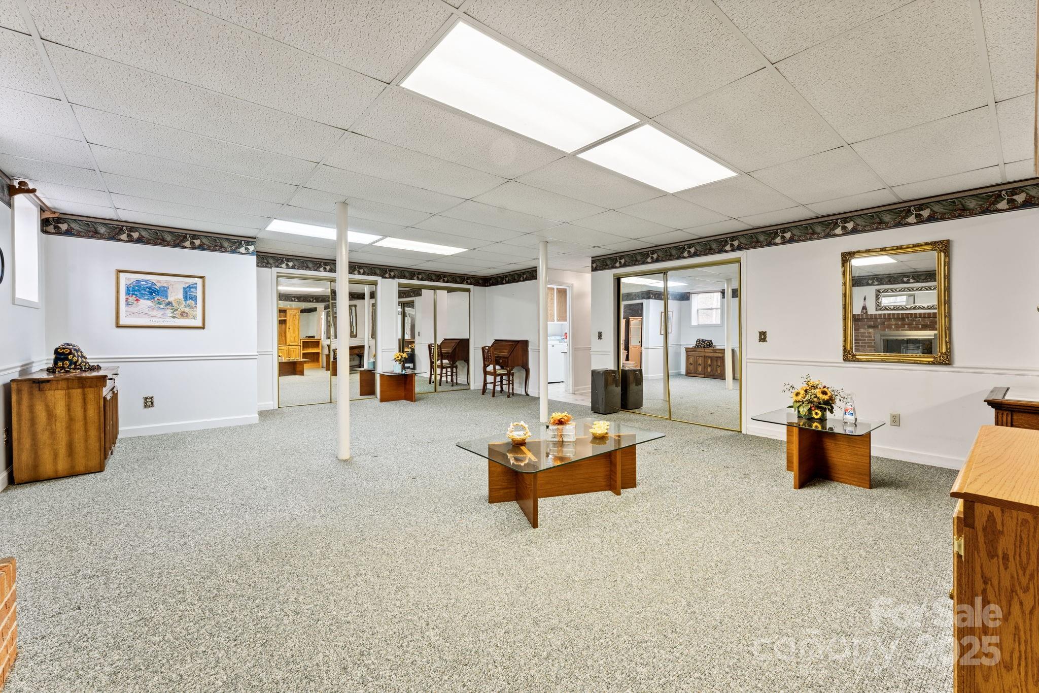 184 Trimont Mountain Road Franklin, NC 28734 - Photo 32 of 41 a living room with furniture and a flat screen tv