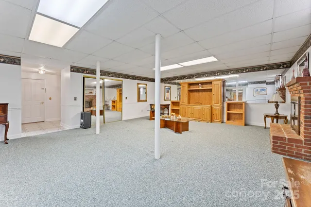 a view of a livingroom with furniture and a ceiling fan