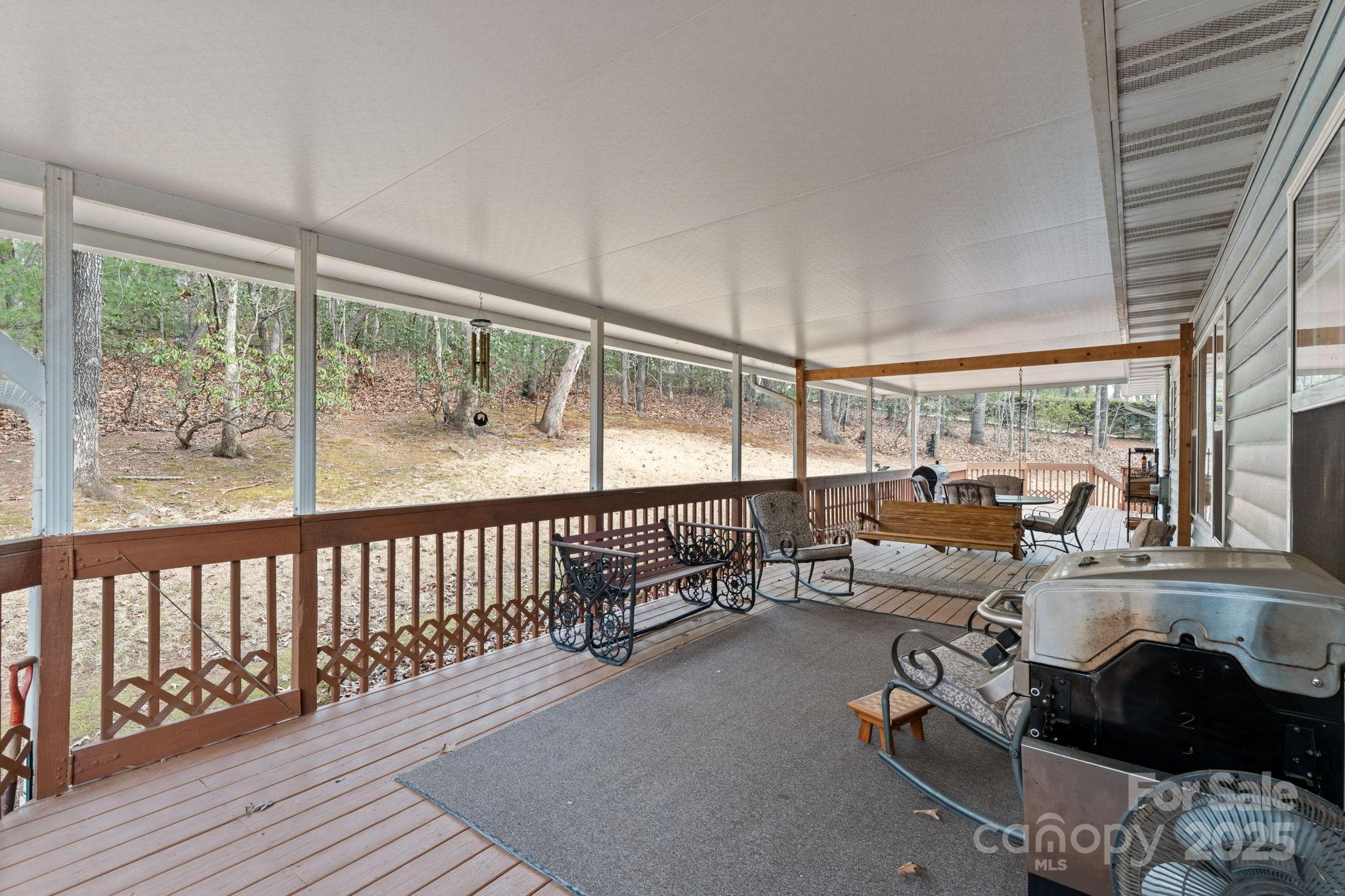 184 Trimont Mountain Road Franklin, NC 28734 - Photo 35 of 41 a living room with furniture and a large window
