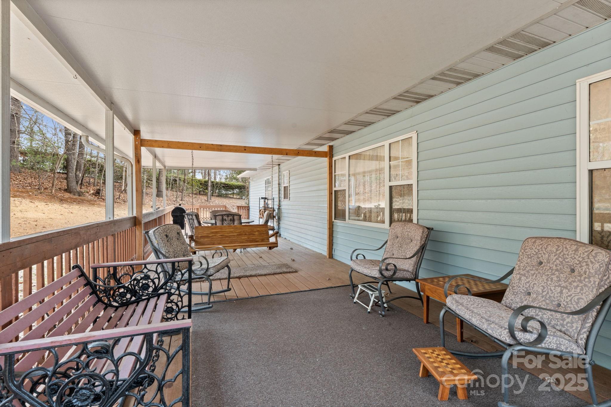 184 Trimont Mountain Road Franklin, NC 28734 - Photo 36 of 41 a living room with furniture and a large window