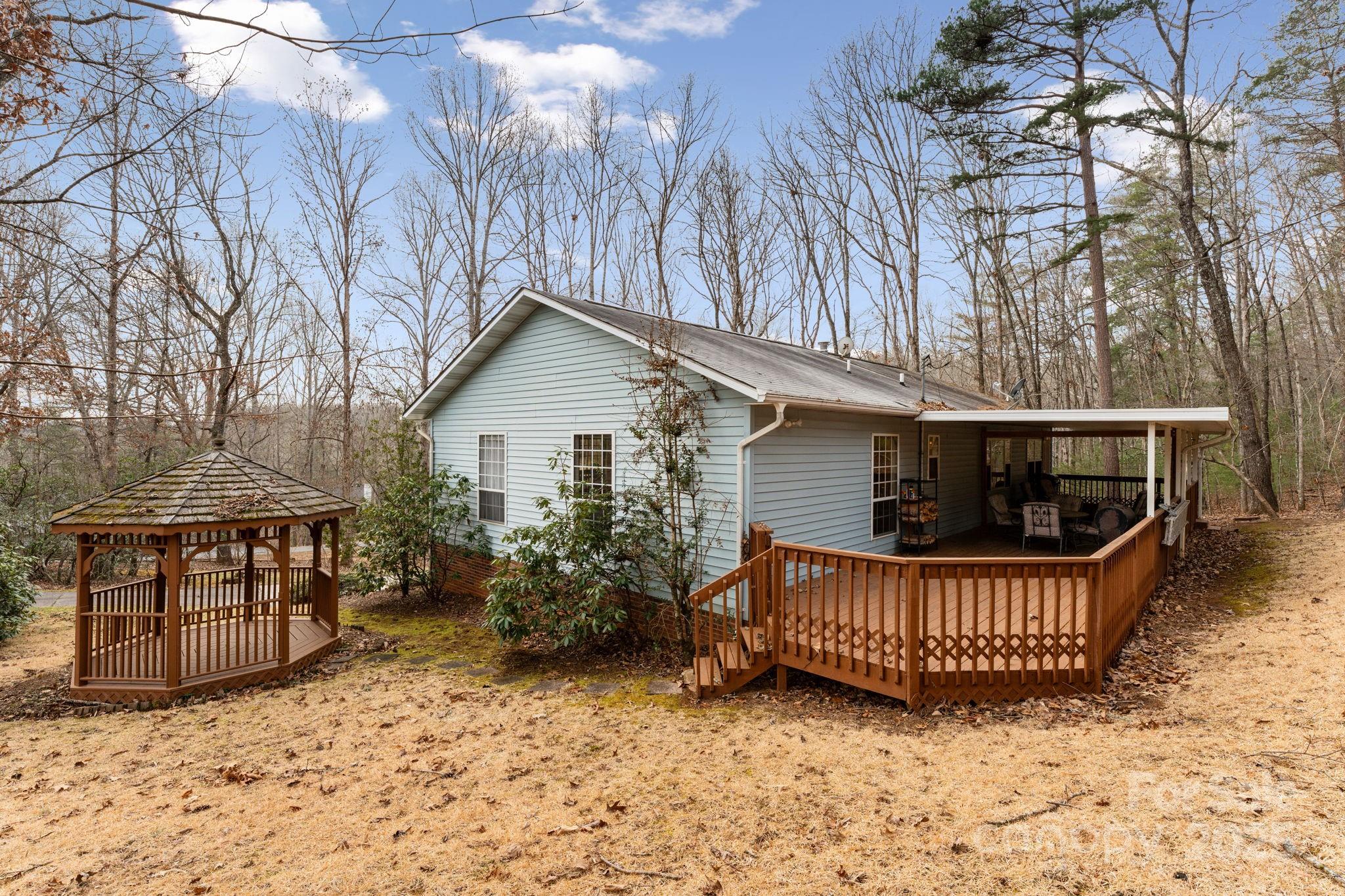 184 Trimont Mountain Road Franklin, NC 28734 - Photo 37 of 41 a view of house with roof deck and furniture