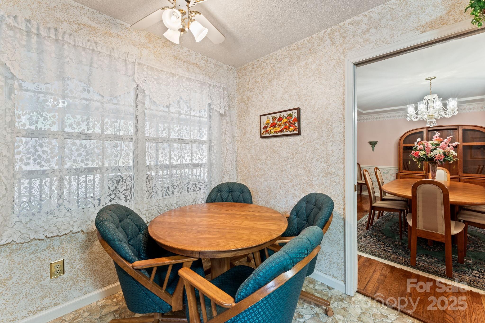 184 Trimont Mountain Road Franklin, NC 28734 - Photo 7 of 41 a view of a dining room with furniture and wooden floor