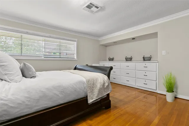 a large bathroom with a granite countertop sink a mirror and shower