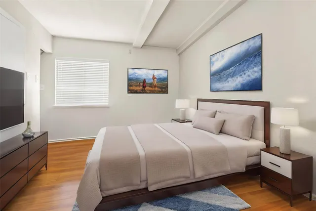 a kitchen with a sink cabinets and wooden floor