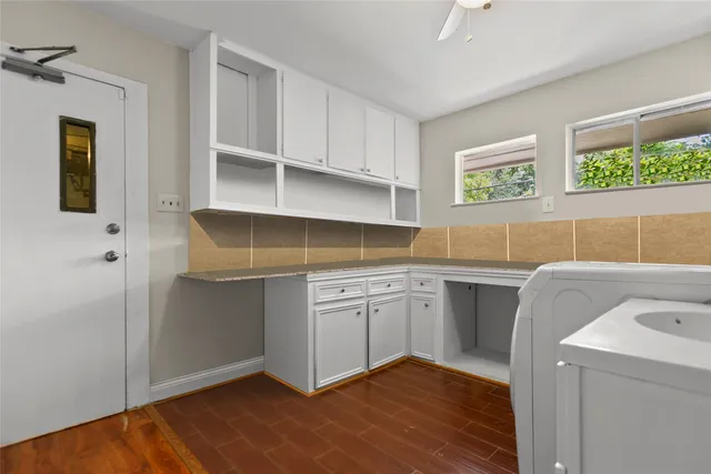 a view of backyard of house with green space