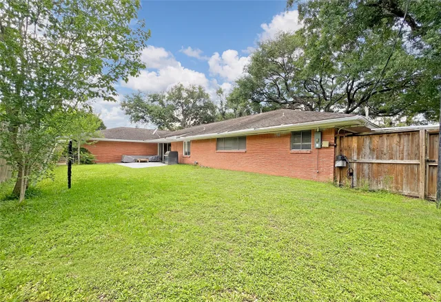 swimming pool with outdoor seating and yard