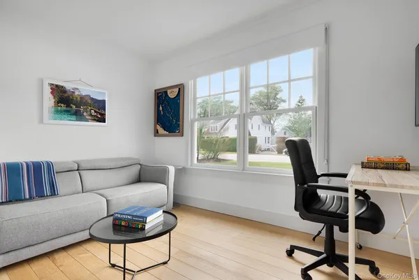 a work room with furniture and windows
