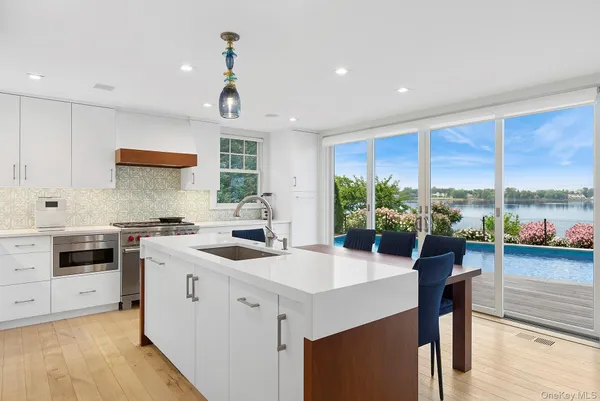 a kitchen with a sink stove and cabinets