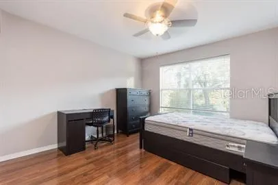 a room with a bed furniture and a window