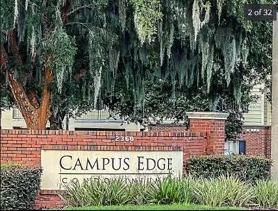 a view of outdoor space with signage and flags