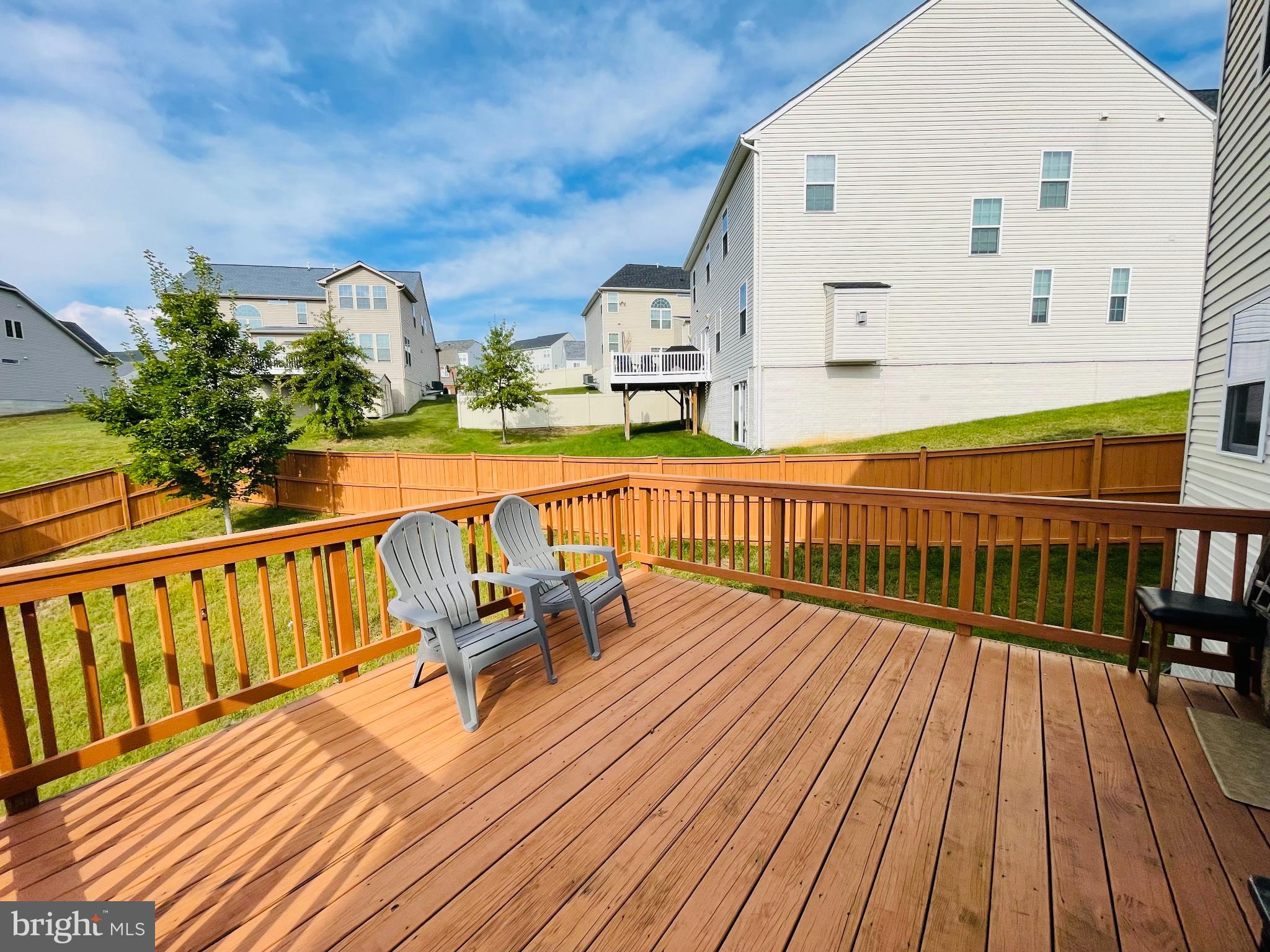 3214 Fledgling Circle Woodbridge, VA 22193 - Photo 12 of 30 a view of balcony with wooden floor and outdoor seating