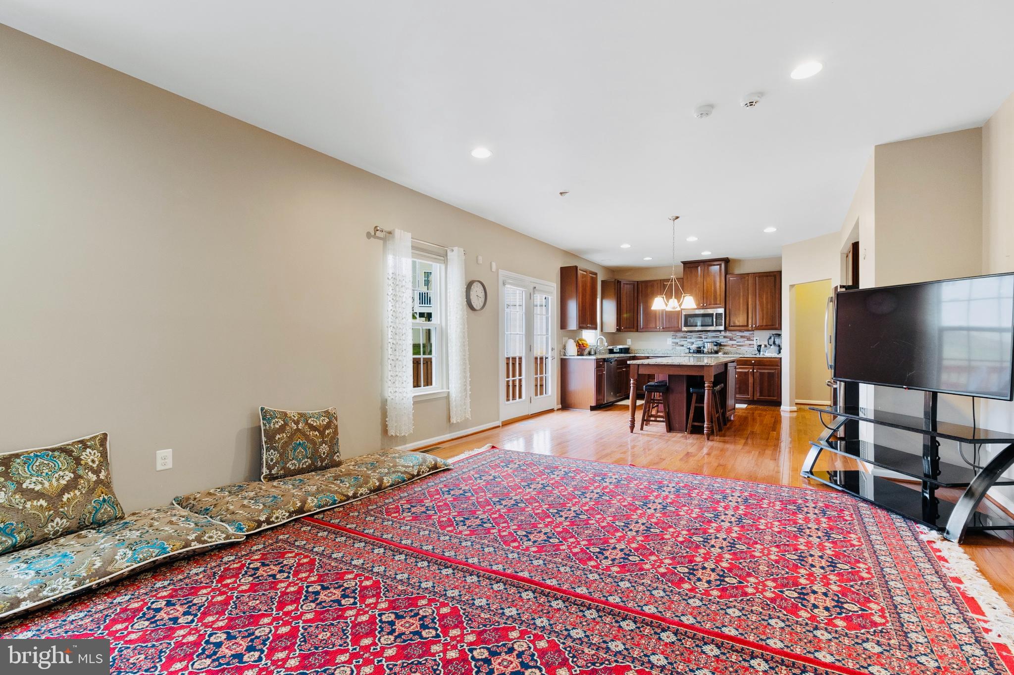 3214 Fledgling Circle Woodbridge, VA 22193 - Photo 14 of 30 a living room with furniture and a flat screen tv