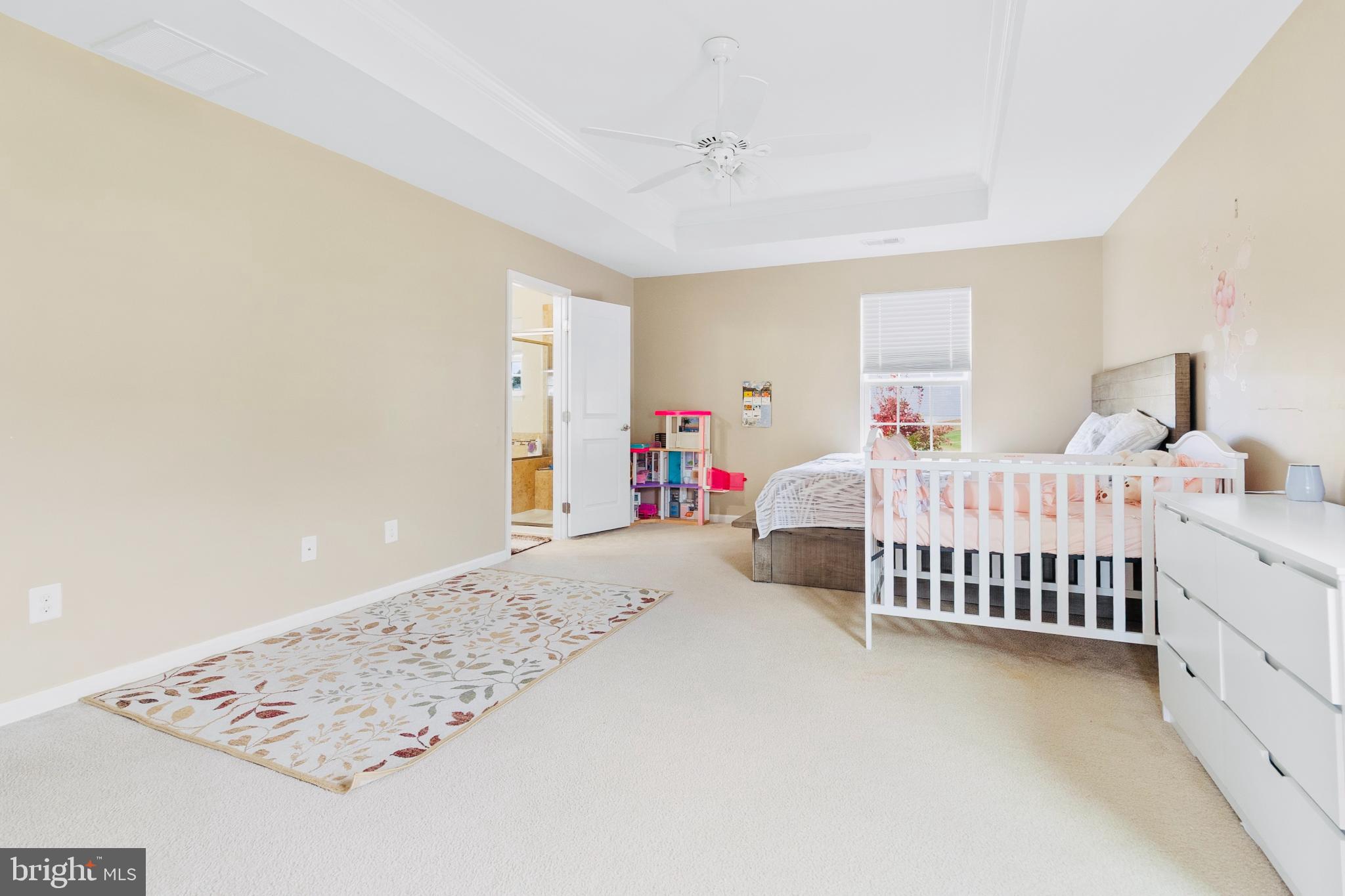 3214 Fledgling Circle Woodbridge, VA 22193 - Photo 26 of 30 a bedroom with three beds and a chandelier