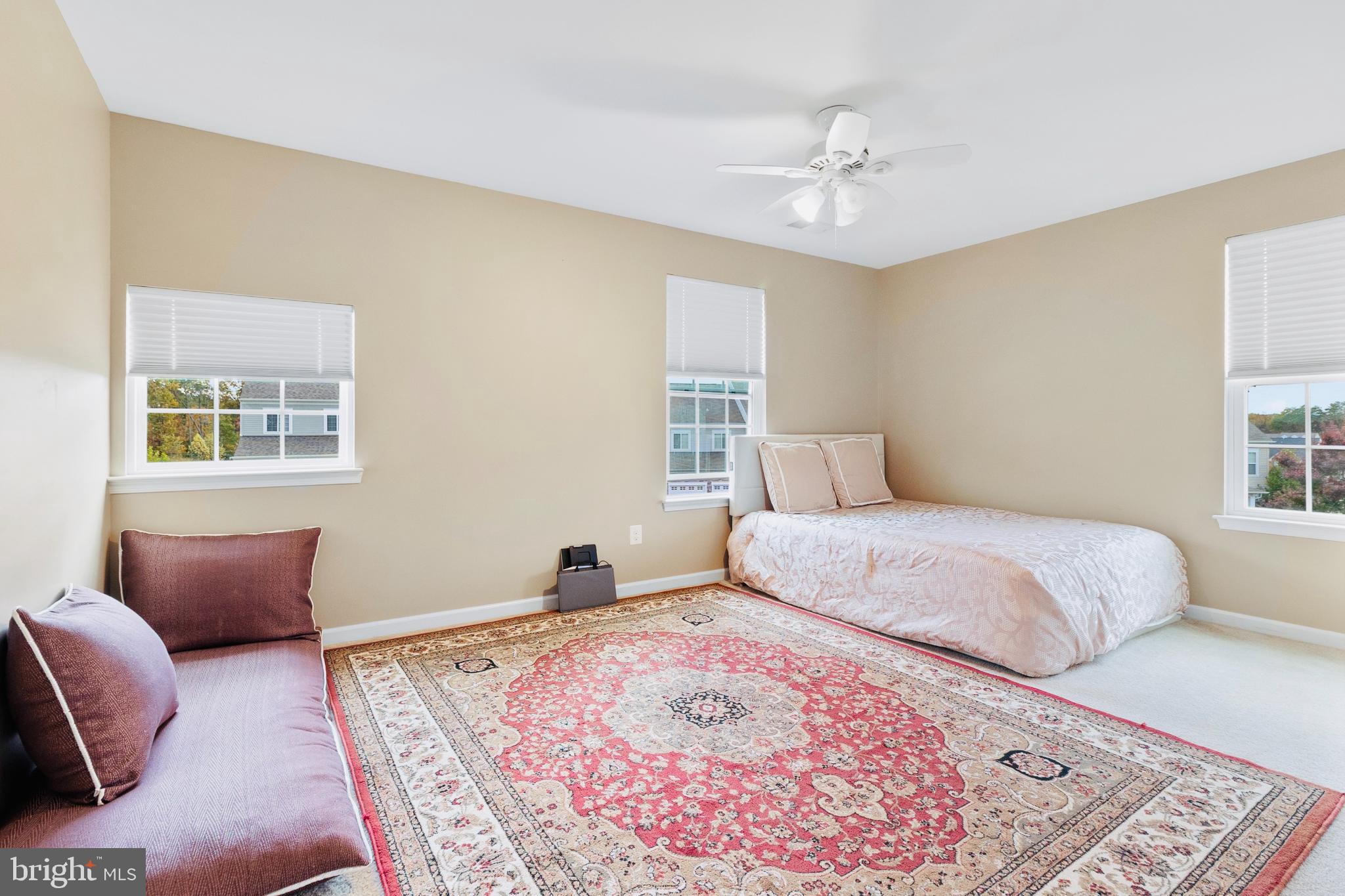 3214 Fledgling Circle Woodbridge, VA 22193 - Photo 27 of 30 a bedroom with a large bed and a couch
