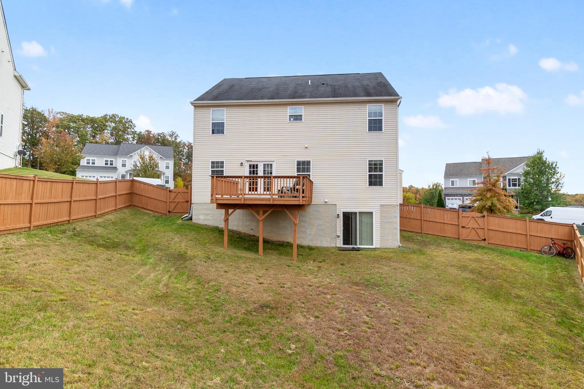 3214 Fledgling Circle Woodbridge, VA 22193 - Photo 30 of 30 a view of a white house with a yard and sitting area