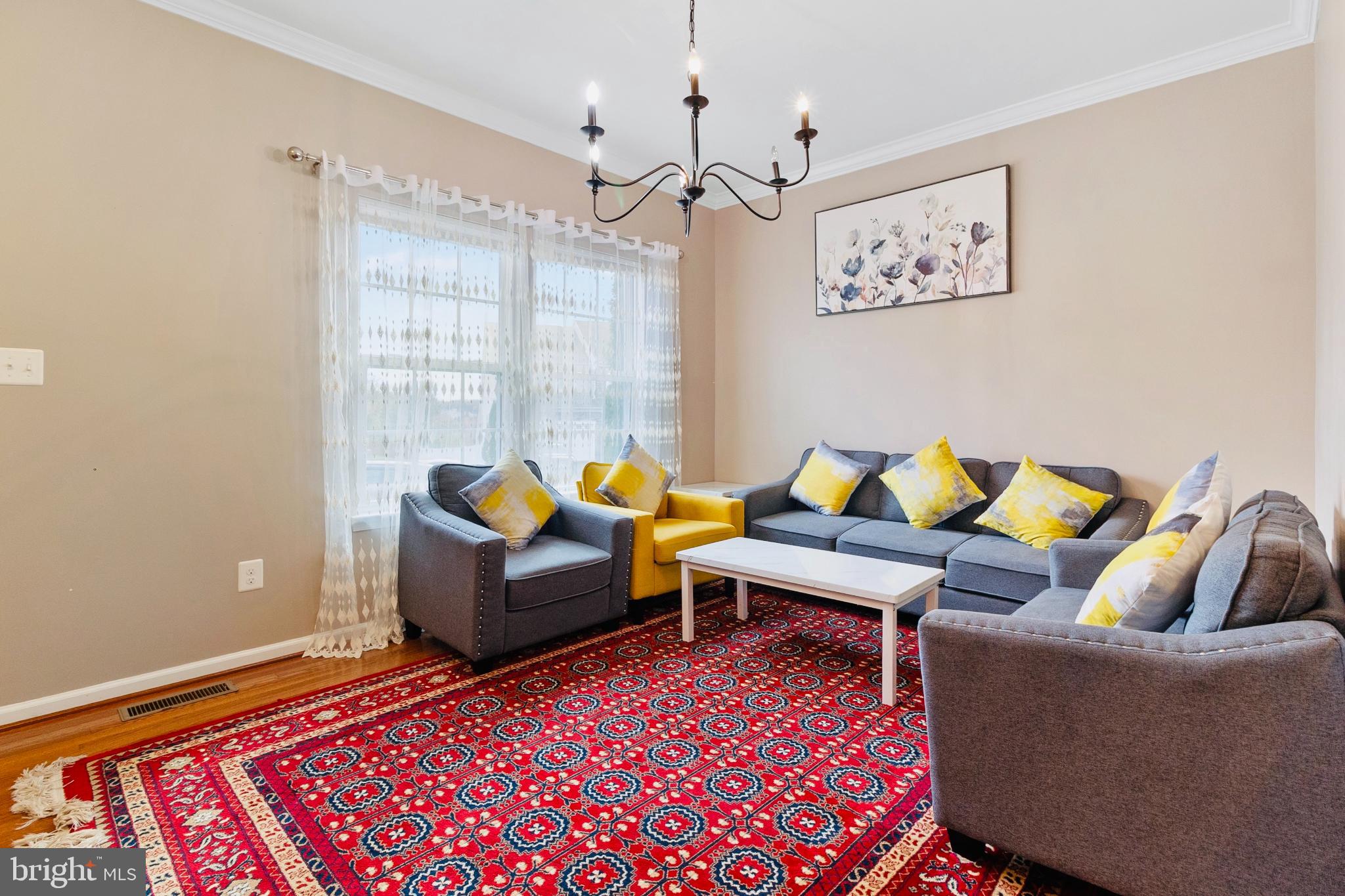 3214 Fledgling Circle Woodbridge, VA 22193 - Photo 9 of 30 a living room with furniture and a rug