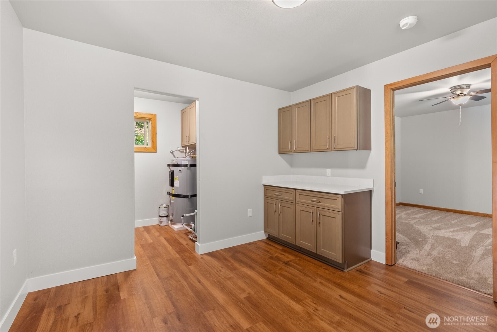 259-10 Tooley Road Toledo, WA 98591 - Photo 14 of 40 a kitchen with granite countertop a sink cabinets and wooden floor
